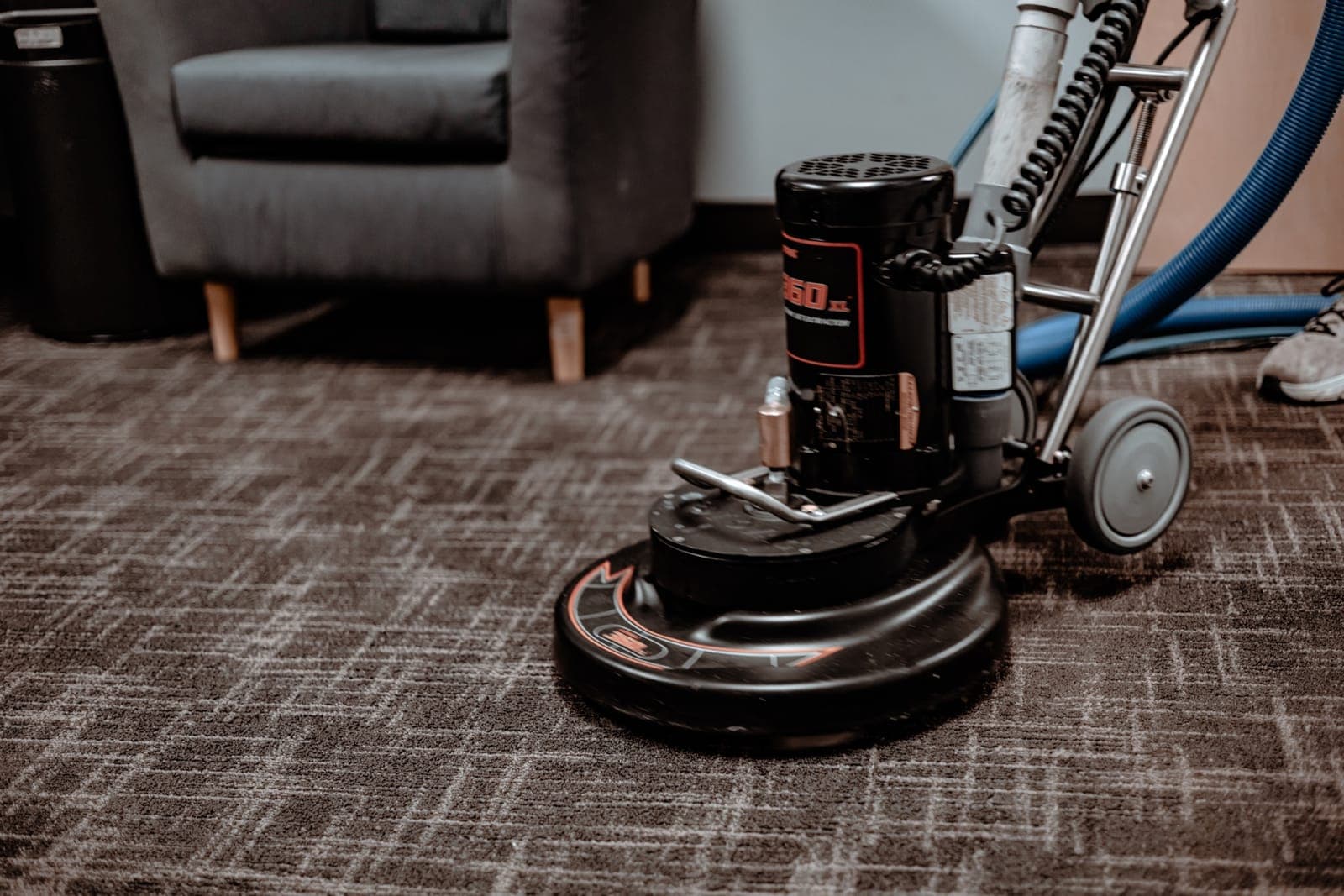 Commercial 360 XL rotary machine cleaning carpet tile in a commercial facility