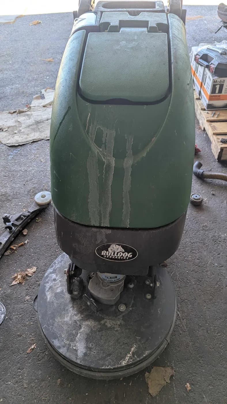 Scrubber housing before cleaning, covered in dried residue