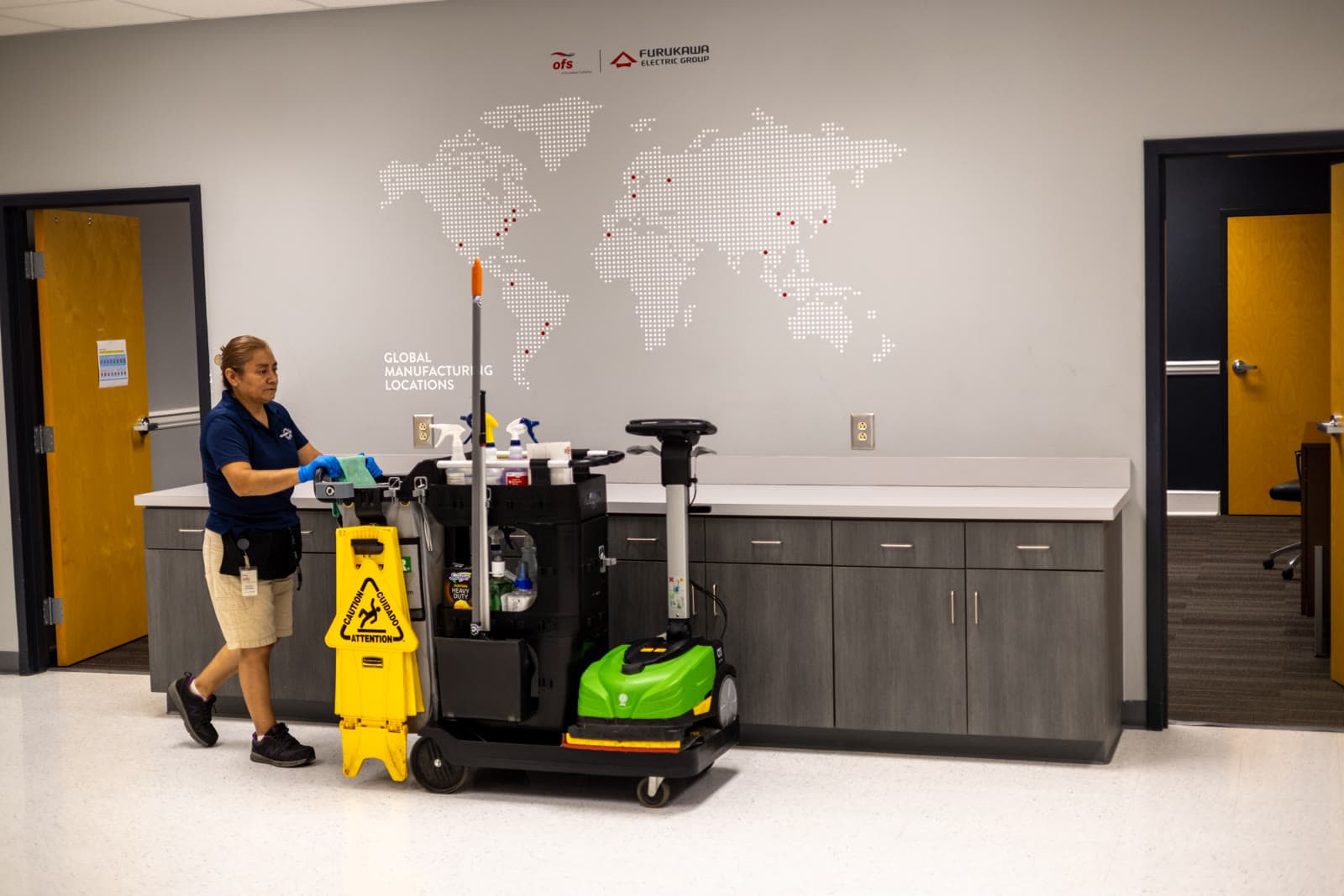 MFS technician with janitorial cart at Lightera manufacturing facility