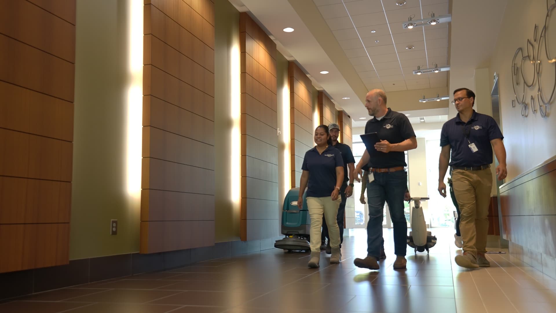 Millennium Facility Services team walking through a facility together